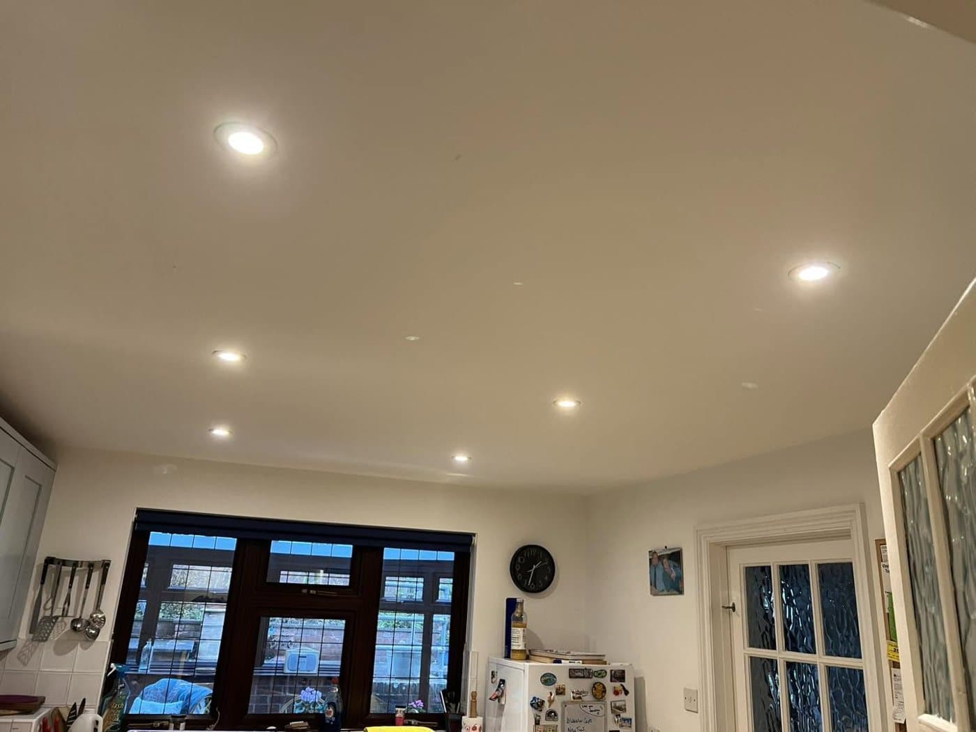 Open-plan living space fitted with recessed LED downlights